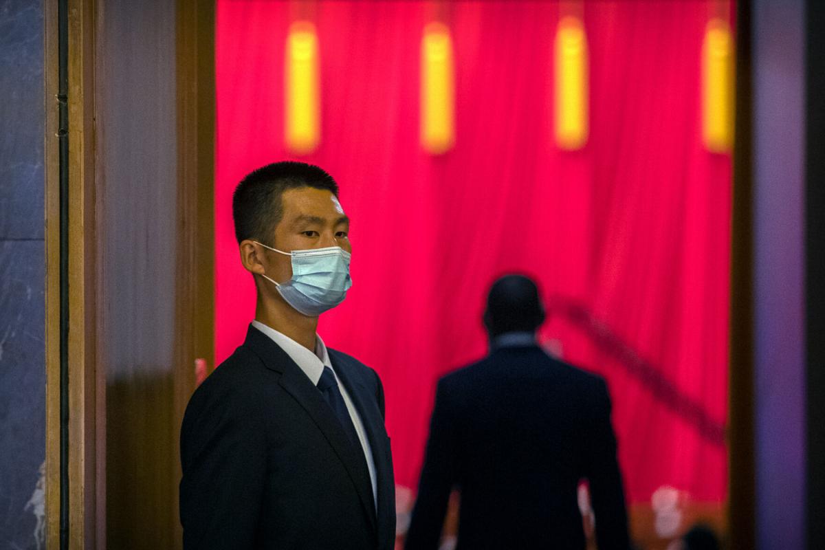 The Latest: Hong Kong to further ease virus measures