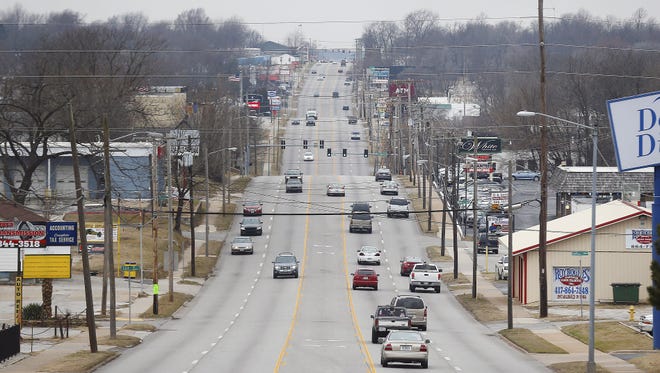 Cars and trucks travel along Kearney Street in Springfield on Feb. 8, 2017.