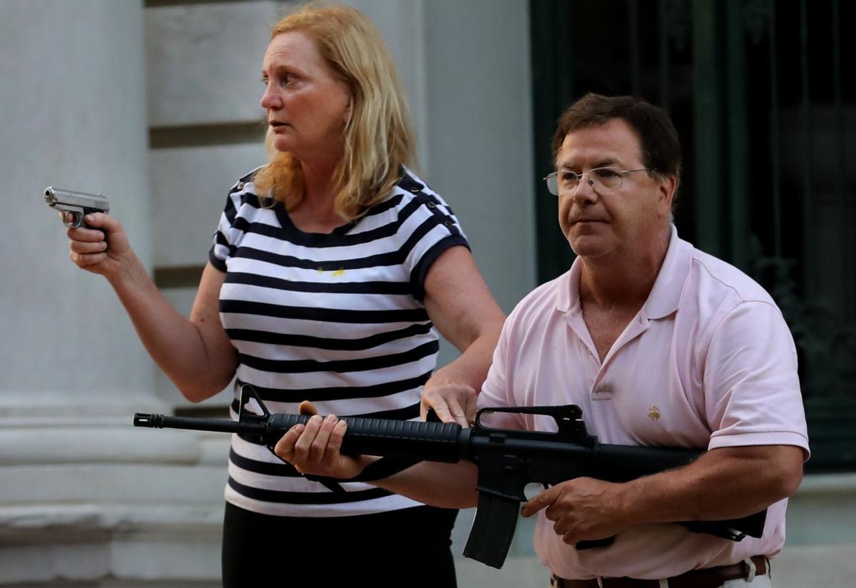 Central West End couple display guns during protest