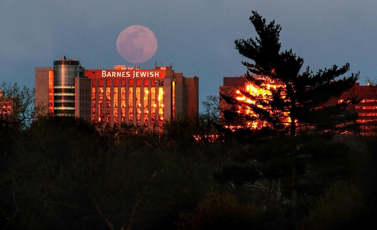 Supermoon rises over healthcare workers